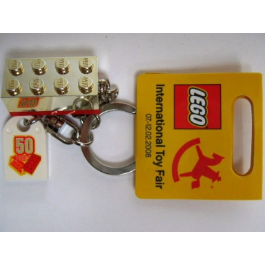 2 x 4 brick - chrome gold key chain with lego 50 year anniversary logo tile modified 3 x 2 curved with hole - international toy fair promo