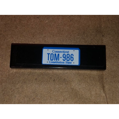 black tile 1 x 4 with tom 986 on black background pattern sticker - set 10242