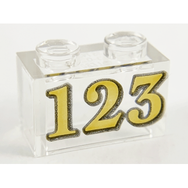 trans-clear brick 1 x 2 without bottom tube with gold 123 pattern