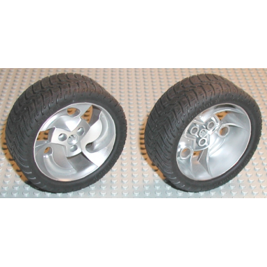 metallic silver wheel 81.6 x 34 zr three spoke swirl with black tire 81.6 x 34 zr thin sporty tread 32197 32196